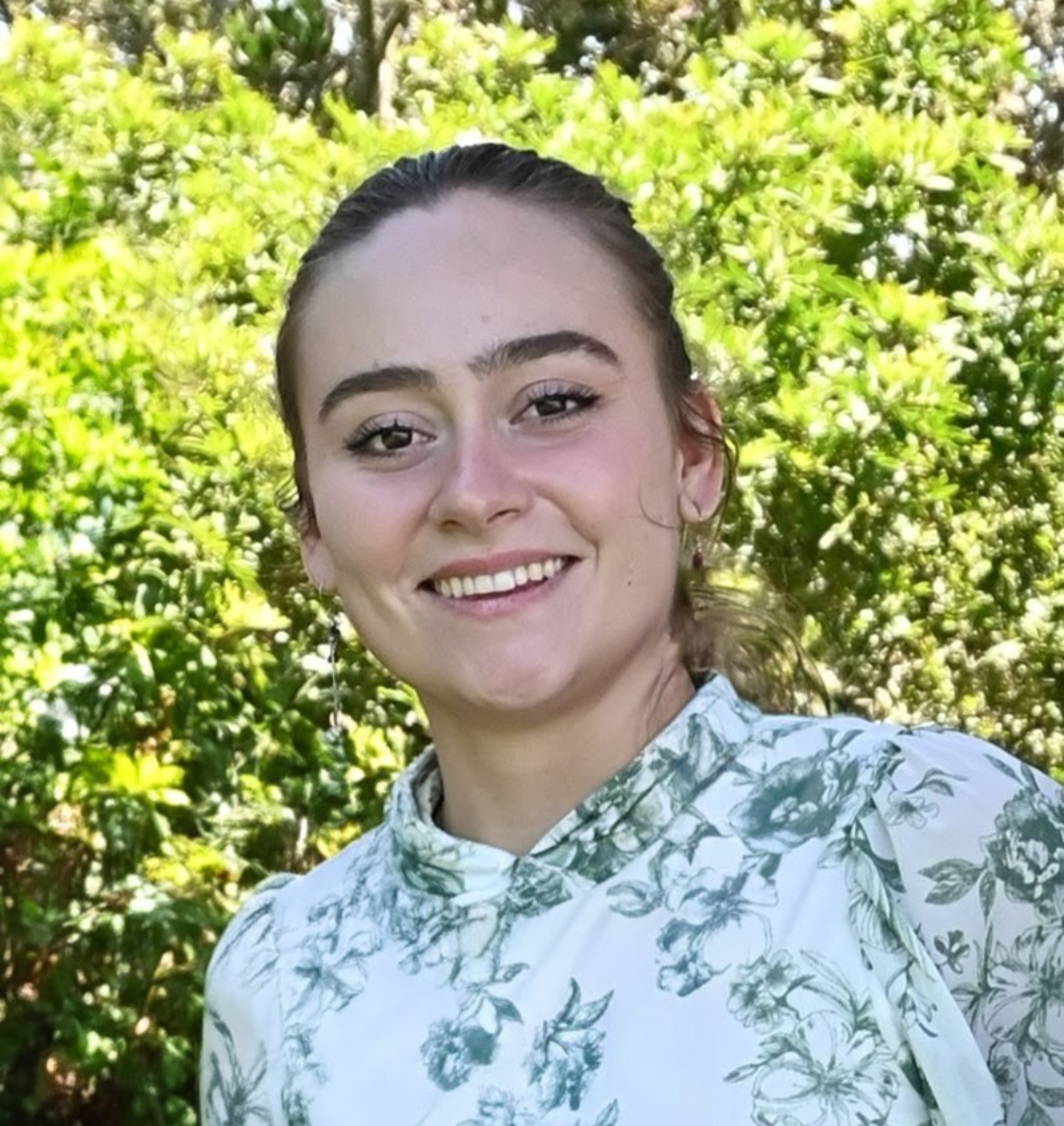 Emily Miller smiling outdoors.